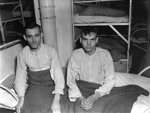 Two SS survivors of the Hadamar Institute sit on a bed at the former euthanasia facility